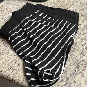 Two pair of athletic shorts 1 solid,1 striped size medium (8-10)